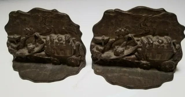 Cast Iron bookends (pair)  Horse drawn carriage/wagon scene