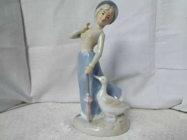 Vintage Porcelain Figurine of a Charming Girl with a Goose