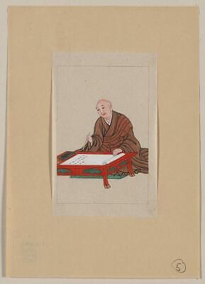 An old man,possibly a monk or scholar,a low table writing on scroll with brush