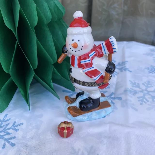 Snowman Skiing Porcelain Hinged Trinket Box w Present  Hand Painted 4.25” tall