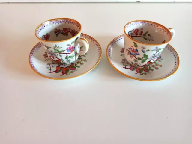 2 Anciennes Tasses et sous tasses à décor floral polychrome  C/52