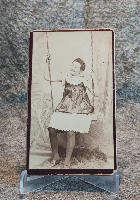 CDV.  Civil war era.  Young African American woman on a swing.  E.S. Dunshee.