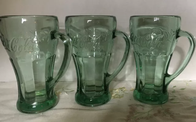 Three Vintage Coca-Cola heavy green mugs with handles