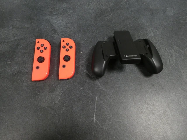 support Joy-con ( grip ) + 2 mannettes pour Nintendo switch ( hors service )
