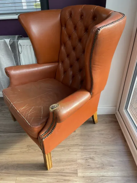 leather chesterfield style arm chair.