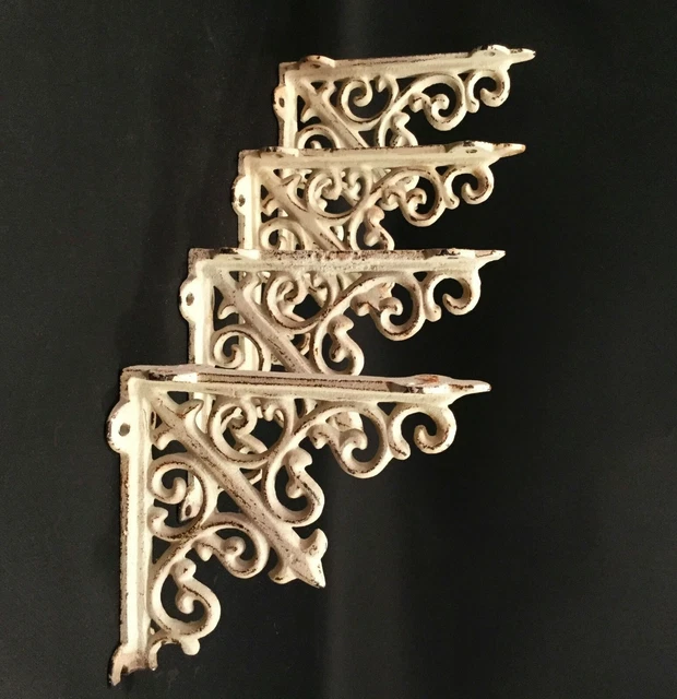 Vintage French corner brackets. Antique white with distressing. Cast iron. two p