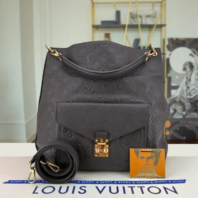 Louis Vuitton Burgundy Empreinte Petillante Clutch. Stunning shape