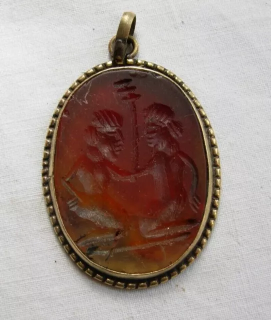 Vintage incised carnelian pendant with man and woman set in metal -middle east