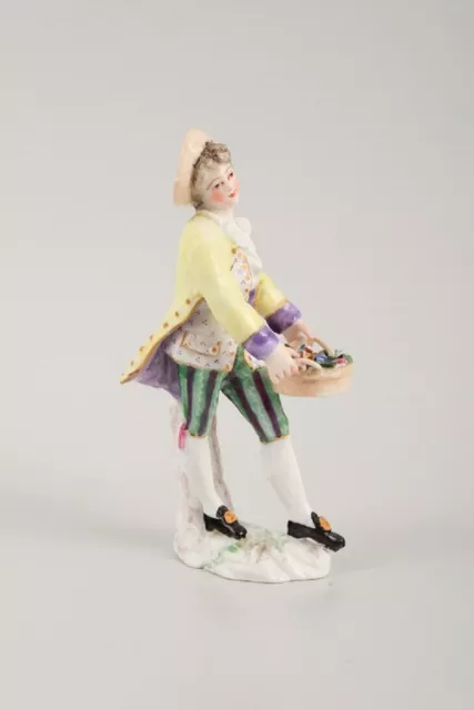 Presumably German porcelain figure, man with flower basket, 19th century. 2