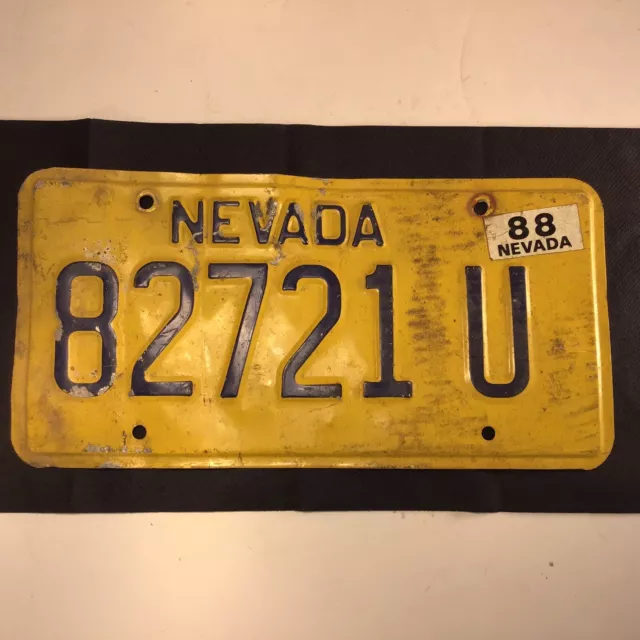 Nevada license plate passenger car used. expired. Yellow 1988 Automobilia