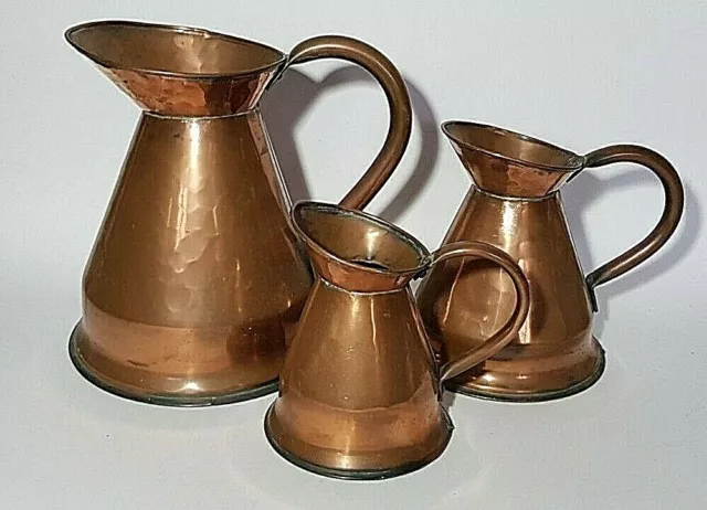 Graduating Set Of 3 Antique Hammered Copper Haystack Measures Jugs Pitchers