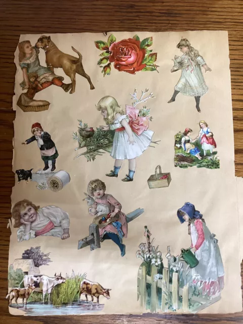 Página de libro de recortes troquelada de colección del siglo XIX con tarjetas victorianas y troquelados en ambos lados