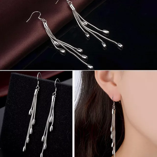 Boucles d'oreilles pendantes en crochet en argent sterling avec pompon long