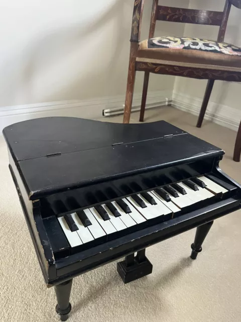 Victorian child’s Blue Ribbon baby grand piano, black, wooden, used condition