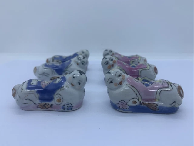 6 Sobrestantes de mesa con cuchara para palillo en forma de Buda de cerámica rosa y azul vintage