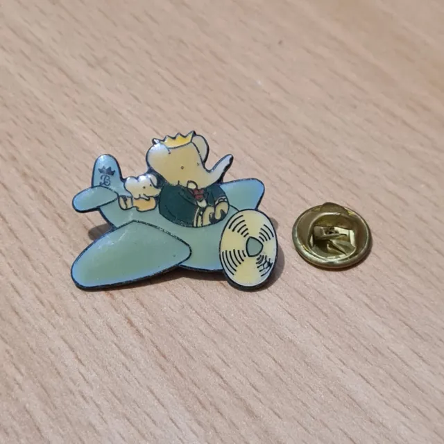 (19) pin's publicitaire babar 1990 brunhoff avion