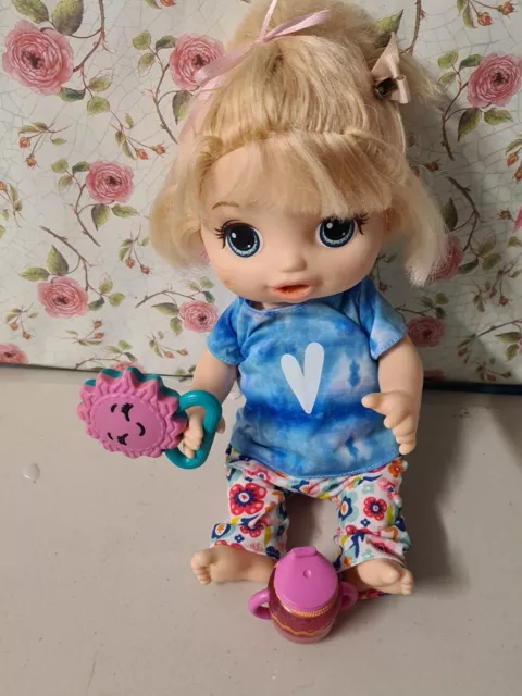 Baby alive doll with rattle and tiny sippy cup bottle