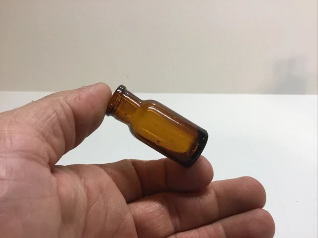 Tiny Antique Amber Cork Top Medicine Bottle.