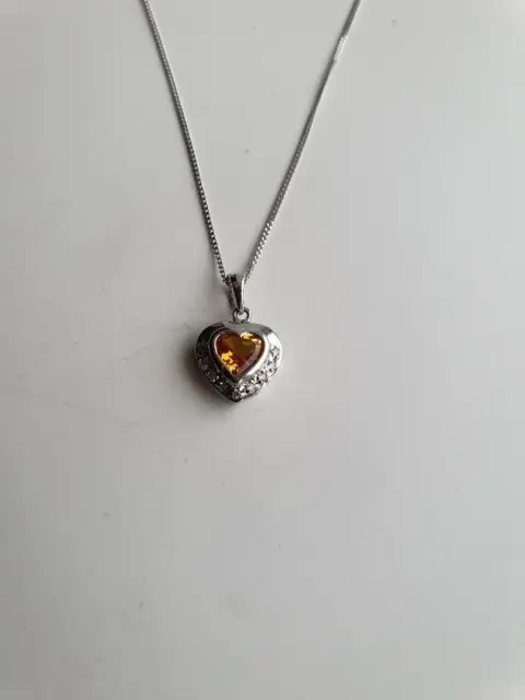 9ct White Gold Heart shape Citrine and Diamond pendant on an 18” curb chain.