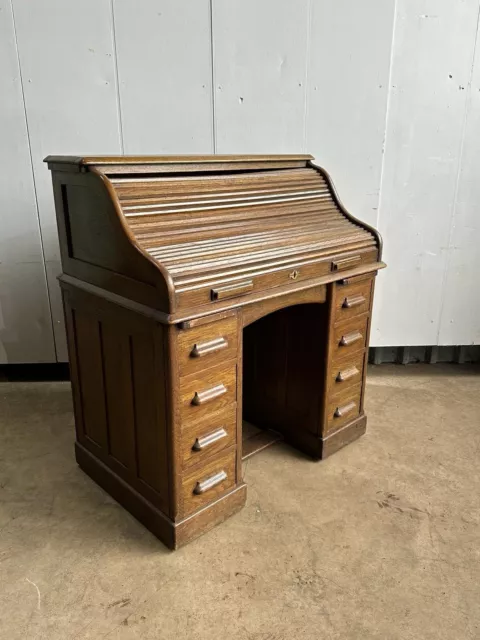 An oak 1920's roll-top desk by Lebus