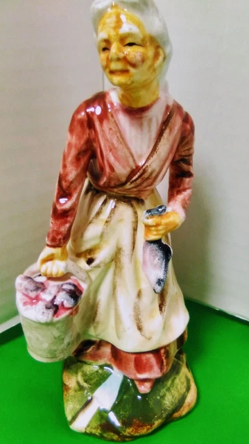 Vintage Japan Ceramic Elderly Women Carrying a Bucket of Fish1 in hand Figurine