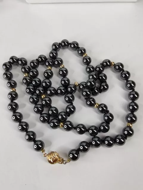 Hematite and real 14K yellow gold hand knotted necklace - 27&1/2" long.