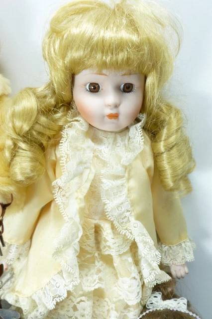 Lot of 11 Bisque Porcelain Cloth Jointed Doll Figurines American Mint DanDee 11