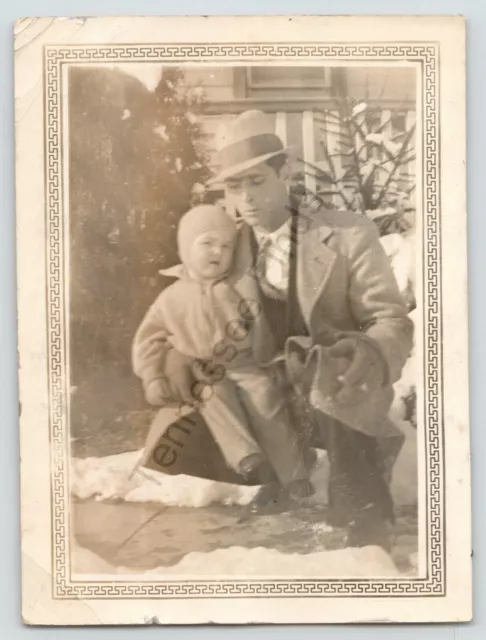 Man Holding A Toddler in The Snow Family Snapshot Photo Picture