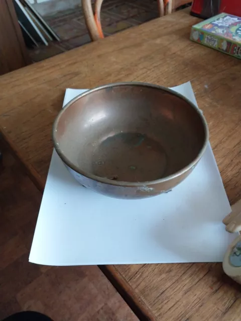 Antique Arts & Crafts copper trinket bowl hand beaten three brass claw feet.