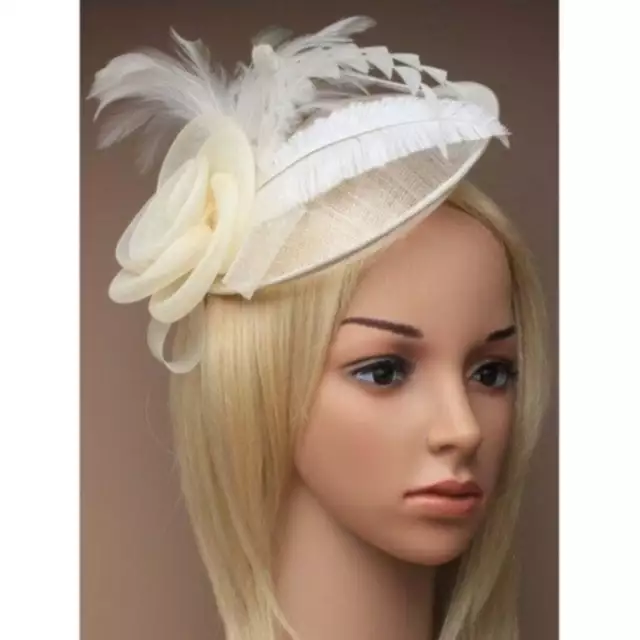 Ladies cream fascinator. Simulated net flower and feathers on an alice band