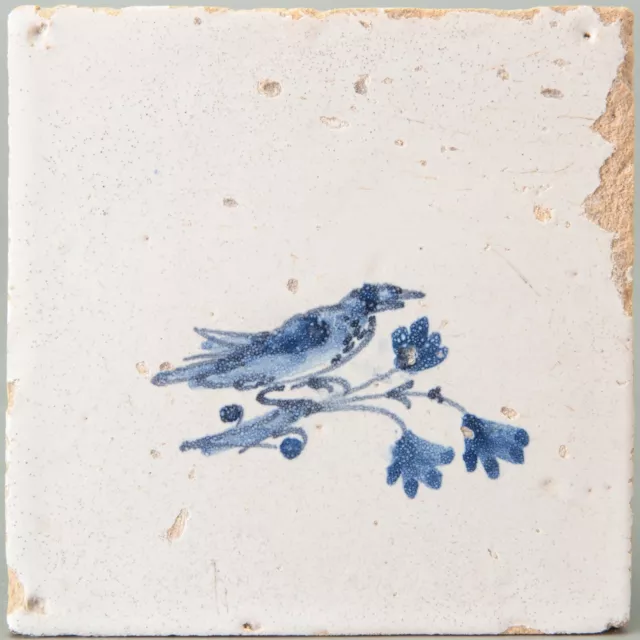 Nice Dutch Delft Blue animal tile, bird on a branch, 17th century.