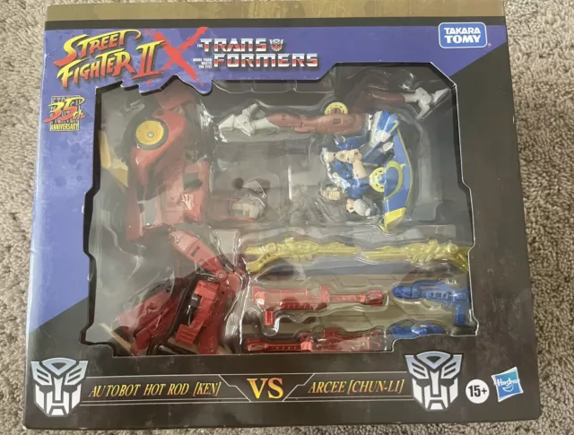 Street Fighter II Transformers Autobot Hot Rod Ken Vs Arcee Chun-Li