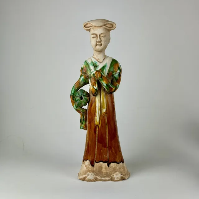 Sancai-Glazed Mingqi Statue Of Court Woman Attendant Holding A Large Fruit