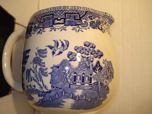 blue and white willow pattern china milk jug