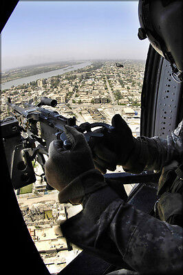 Poster, Many Sizes; Uh-60 Black Hawk Helicopter Door Gunner Provides Security As