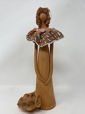 Female clay statue faceless with basket for flowers artist signed 1991 See pics.