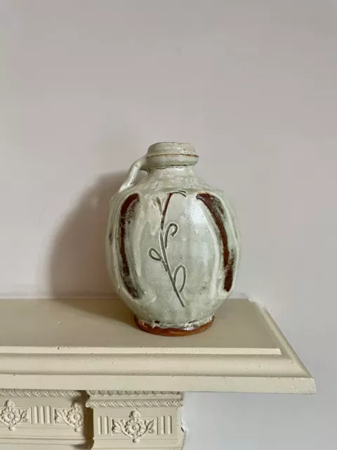 A MIKE DODD Single-handled vase, covered in a broken ash glaze 18cm High Signed