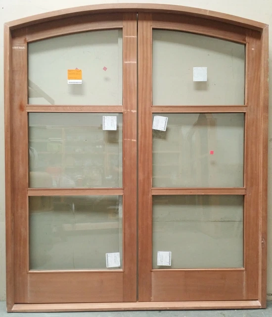 Rustic reclaimed lumber eyebrow arch double door solid wood castle winery glass