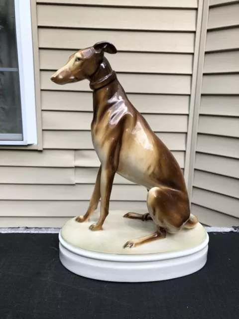 Sold at Auction: VINTAGE TUPPERWARE INCLUDING ROUND CAKE CARRIER, SQUARE  CONTAINER & SEVERAL SMALLER CONTAINERS, VINTAGE PORCELAIN TAN  GREYHOUND/WHIPPET LURCHER DOG SCULPTURE + 1 OTHER FIGURE