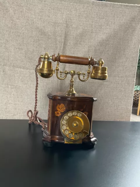 Antique inlaid telephone.  Solid brass handset and dial. Very unusual.