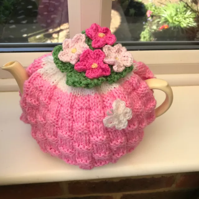 HAND KNITTED BASKET WEAVE TEA COSY FLOWERS BUTTERFLY  FOR A  MEDIUM POT Pink