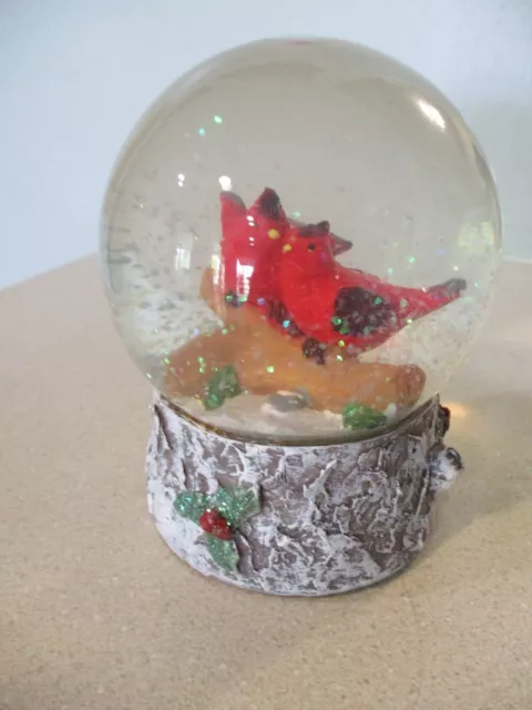 glass snow globe with pair of red cardinals sitting on log in snow 4 1/2 x 4 ''