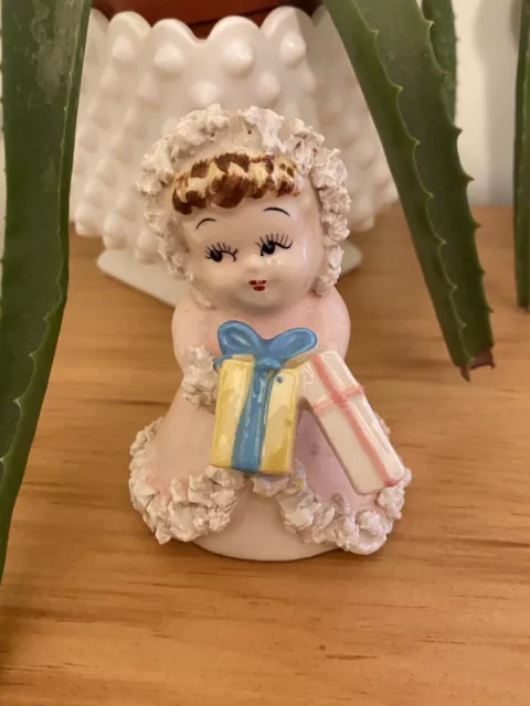 vintage Japan ceramic Christmas girl figurine carrying presents spaghetti trim