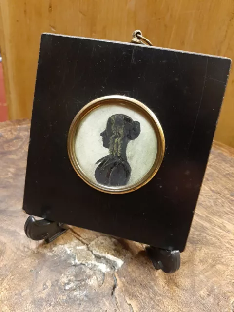 Antique late 18th/early 19th century silhouette portrait of a  Female character.