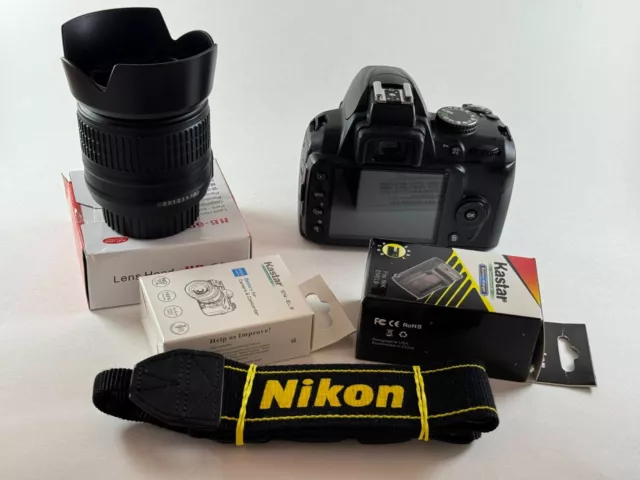 Nikon D D3000 10.2MP Digital SLR Camera w/ AF-S DX VR 18-55mm Lens and more
