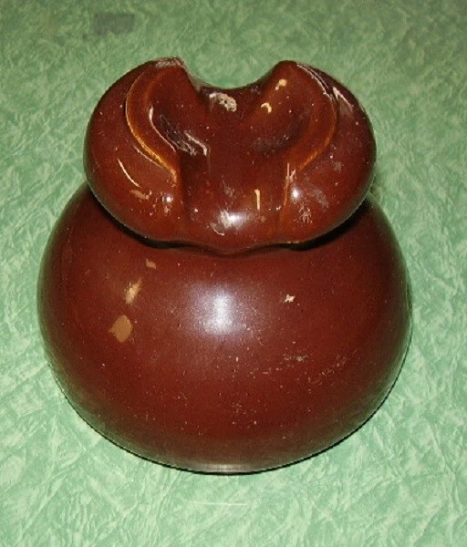 Brown ceramic saddleback insulator