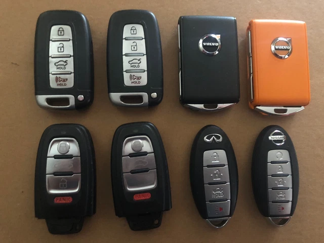 OEM LOT OF (8)  2 NISSAN  REMOTE KEYS FOBS 2 HONDA /VOLVO/ HYUNDAI All WORKING