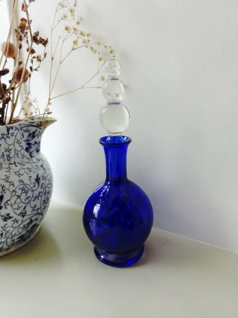 Vintage cobalt blue glass perfume bottle with a clear glass stopper. Murano ?