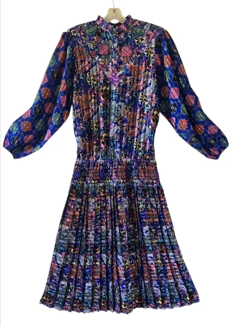 lady tryon kanga dresses An ultimate 80's Aussie icon. A drop waist dress full of ruffles, big shoulders & brightness by Kanga Collections. This label began its life in 1983 in London by Australian Baroness Dale
