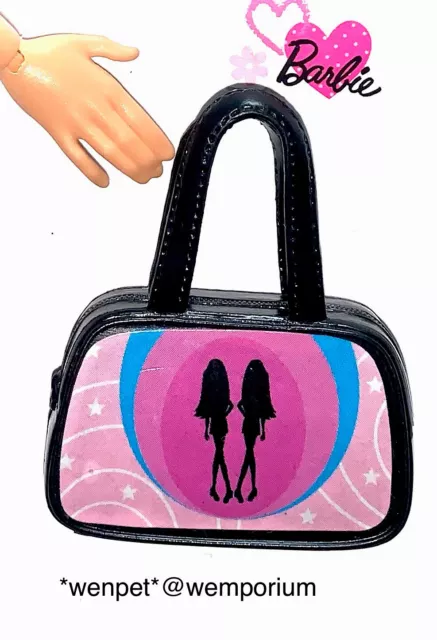 The dolls club bags top